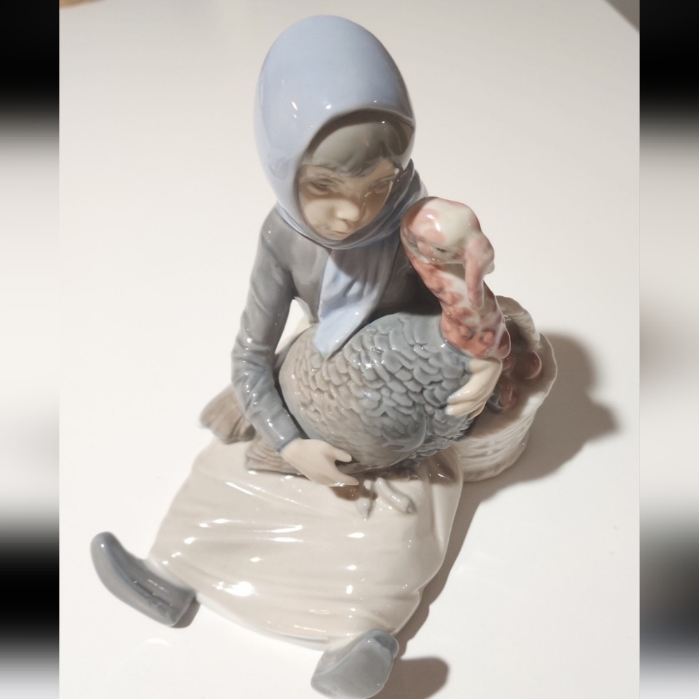 Porcelain Figurine of Woman with Turkey